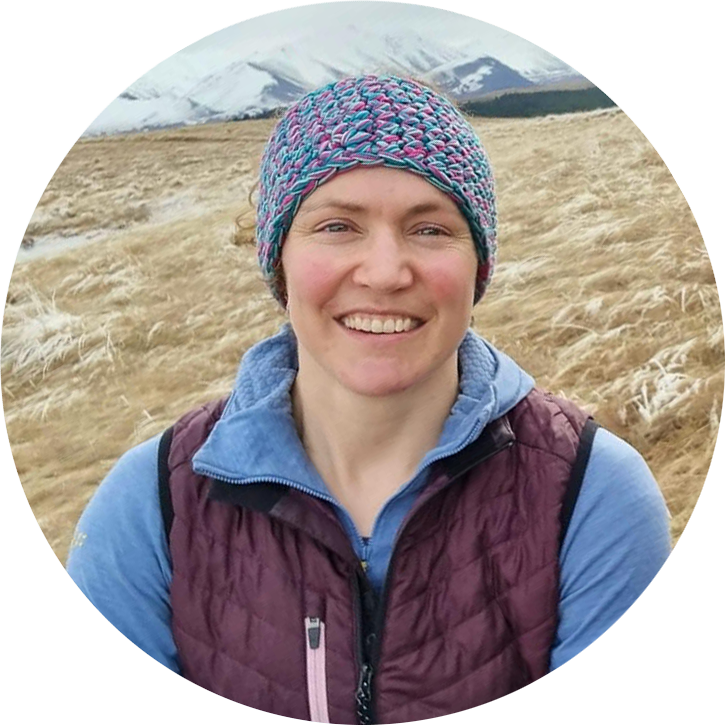 Portrait photo of Carla smiling with snowy tundra in the background