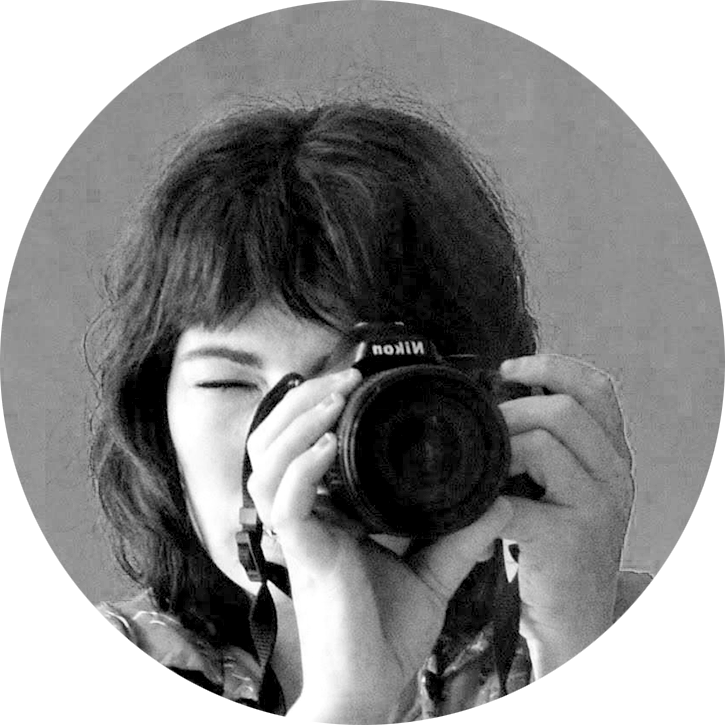 Jess Papini, team member of Matai Media, taking a photo with a Nikon camera